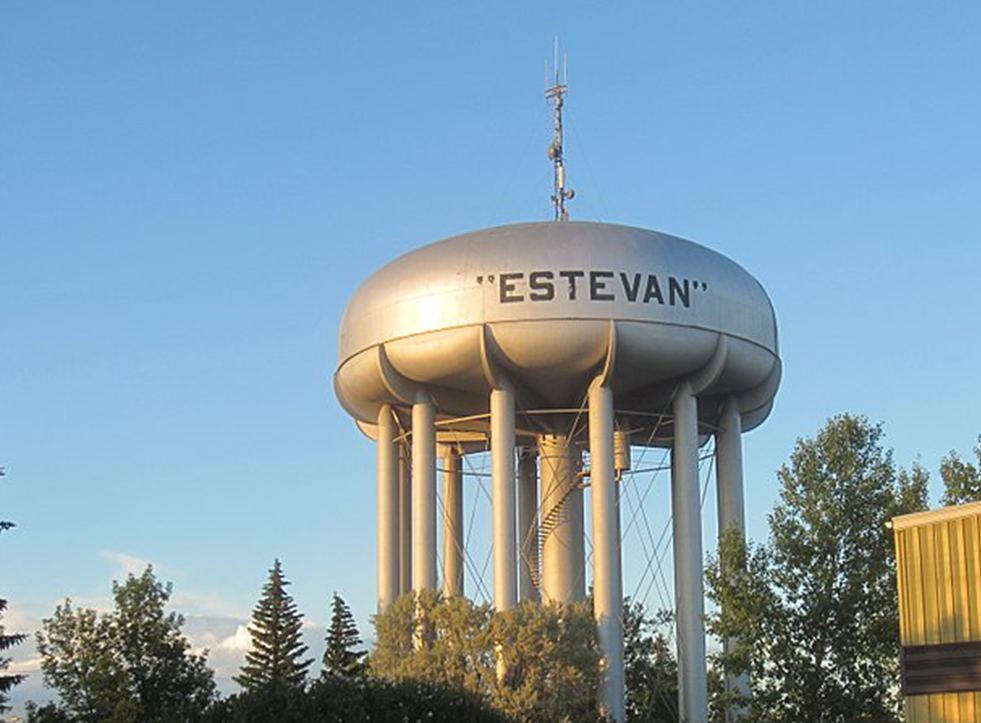 Silver water tower "Estevan" in black block letters. Water tower in Estevan, Saskatchewan.